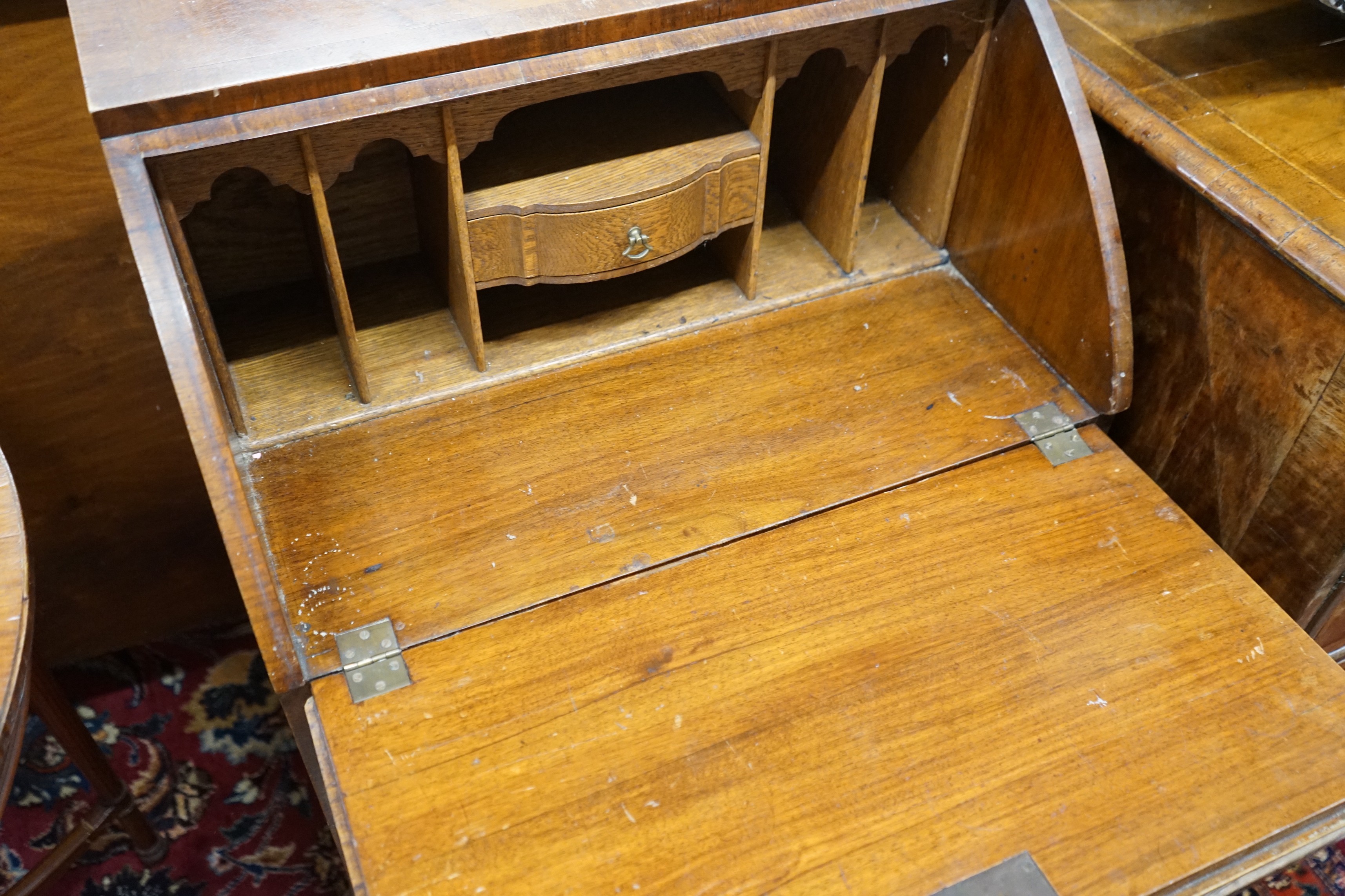 A reproduction walnut bow front bureau, width 58cm, depth 42cm, height 98cm